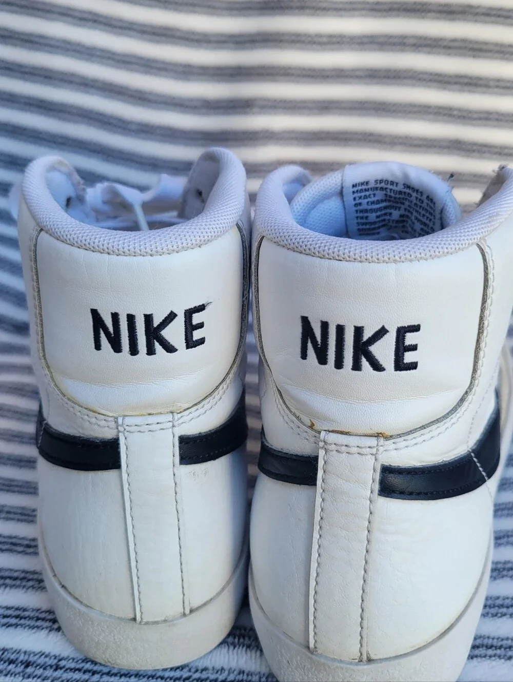 Nike White High-Top Blazers Sneakers with Black Swoosh and Red Tongue Tag